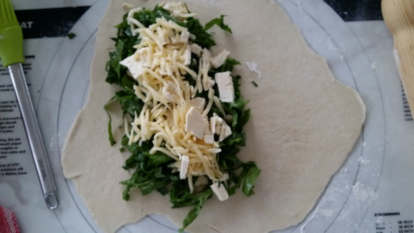 Adding the fillings to the thinly rolled dough for gozleme my green garden